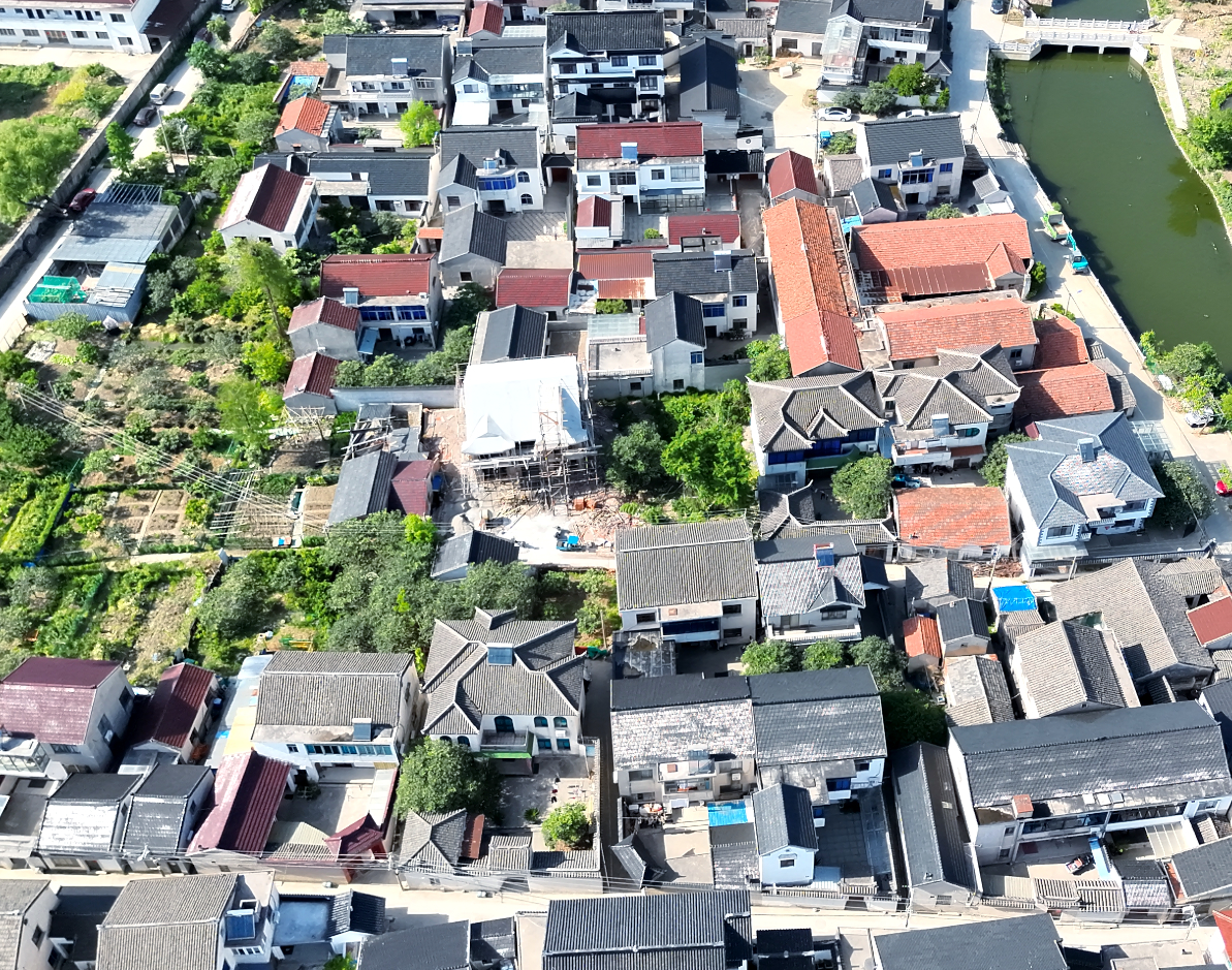 Aerial view of a dense urban neighborhood and construction area